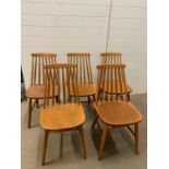 Five spindle back mid century chairs