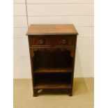 A small framed mahogany hallway unit with two drawers and shelves under on slightly spayed feet