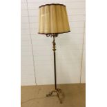 A three arm brass floor standing lamp