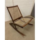 A Danish Hans Wegner style rocking chair with string seat
