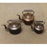 A selection of three vintage cooper kettles