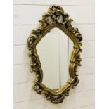 A gilt framed mirror with slight damage (69cm x 44cm)