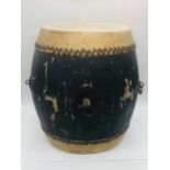 An African tribal drum with metal rings and stud detailing