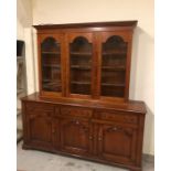 Display Cabinet with three drawers abover three cabinets, and glass doored display cabinets over