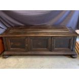 A dark wood sideboard with two doors
