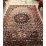 A large patterned rug with some staining but a good size (381cm x 258cm)