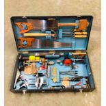 A complete tool box in original wooden case including some original paperwork and a paperback