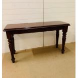 A mahogany hall table on reeded legs (W139cm H78cm D49cm)