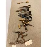 A selection of horse bits and sheep shearing tools etc