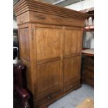 A tall solid pine double wardrobe 220 cm H x 160 cm W x 76 cm D.