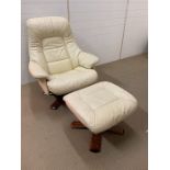 A Leather lounge chair and foot stool on swirl base
