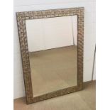 A large bevelled contemporary silver framed mirror (107cm x 76