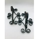 Two decorative wrought iron wall brackets