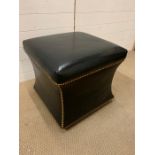 A leather club footstool