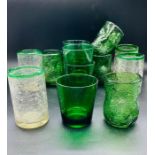 A selection of coloured glassware, crackled clear with green rim, dimpled green and green tumblers