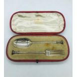 A cased silver hallmarked London Mappin and Webb fork and spoon set