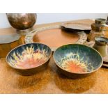 A collection of copper trays, bowls and kettle