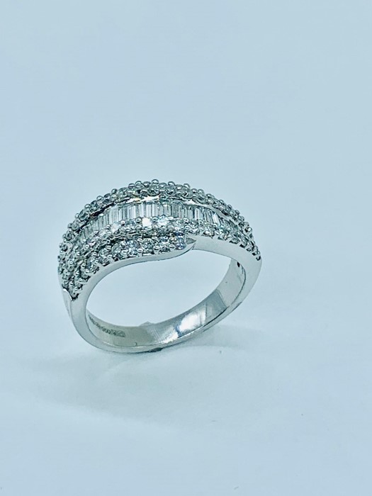 A contemporary diamond ring comprising 25 baguette cut diamonds colour G/H clarity VS2/SI1 ) 0.5