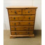 A tall pine Schreiber chest of drawers, two over four