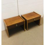 A pair of mid century bedside tables with interesting handles