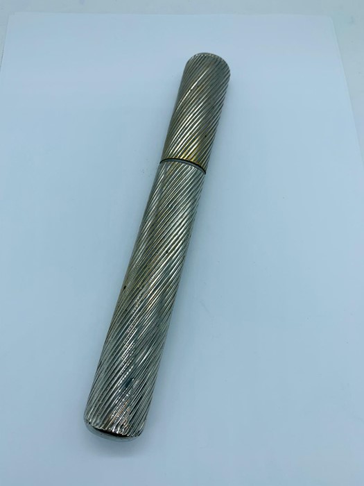 A silver plated pen holder