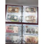 Two albums of International banknotes and coins