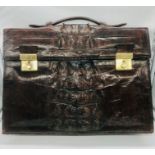A vintage rich brown leather briefcase, very likely crocodile or alligator in excellent condition