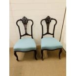 A Pair of Trafalgar Chairs on castors with blue upholstery
