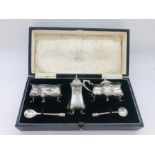 A silver cruet set, hallmarked Birmingham.