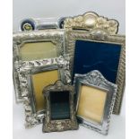 A selection of seven silver coloured/white metal decorative photo frames in various sizes