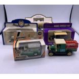 Five Diecast model cars and vans