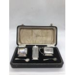 A silver cruet set, makers mark HCD, hallmarked Birmingham 1928.