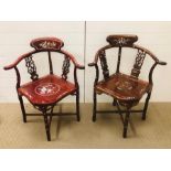 Two Chinese chairs with mother of pearl design.