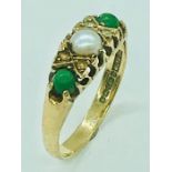 A 9 ct gold ring with central pearl.