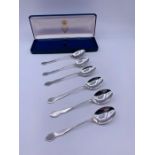 A Set of Six Silver coffee spoons, makers mark JDWD Sheffield 1922.
