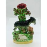 A Staffordshire Spill vase with a donkey and a sheep.