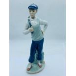 A Nao figure of a golfer