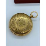 An 18 ct gold key wind pocket watch by maker JTW London 1871 with engraved floral decoration,