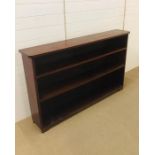 A mahogany dwarf open bookcase (H96cm D28cm W156cm)