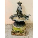 An Victorian style lead bath bird with cherub perched on the side along with a dove, set on a
