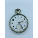 A WWII Frenca British Military Issue Pocket Watch, with religious medal stuck to rear.