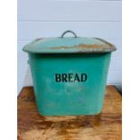 A square green enamel bread bin