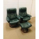 A pair of dark green leather "stress less" chairs by Norwegian company, Ekornes with one matching