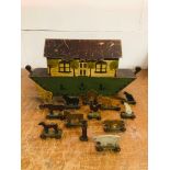 A Folk Art Noah's Art with a selection of twelve wooden animals on wheeled bases circa 1930 and a