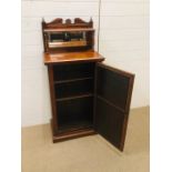 A pretty hall cabinet with bevelled mirrored panels to the door and above