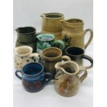 A selection of Studio Pottery, mainly jugs all signed to the base "Maura"