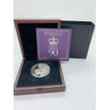 A Silver proof £5 coin celebrating Queen Elizabeth II's 90th Birthday