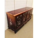 Large Chinese sideboard with mother of pearl design. (H84cm D49cm W182cm)