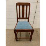 A wooden chair on bobbin legs