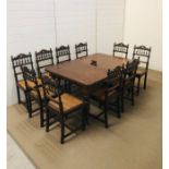 A large oak wind out extra leaf dining table with winder on four turned lobed taperaring legs